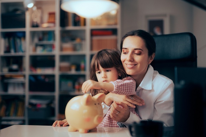 Mother Teaching Daughter About Saving Money and Financial Education. - Copy